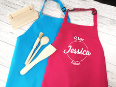 Personalised children's star baker apron in pink or blue