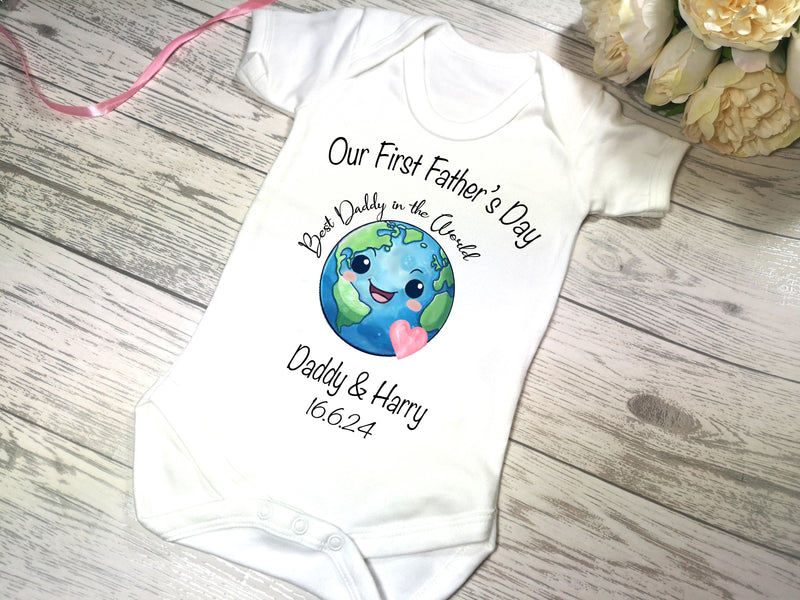 Personalised White Baby vest suit with our first father's day World detail add a name