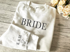 Personalised Unisex WHITE jumper BRIDE with couples initials and heart on sleeve