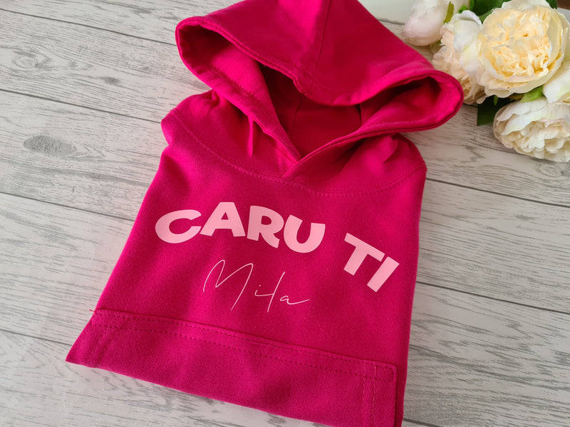 Personalised Welsh Kids Hot Pink hoodie with CARU TI name detail