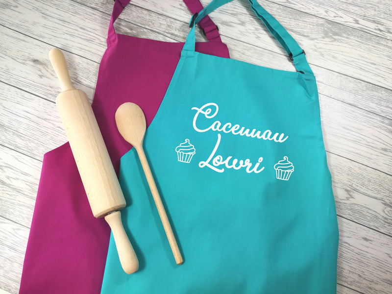Personalised adult Welsh Cacennau apron in raspberry or duck egg blue with choice of coloured detail