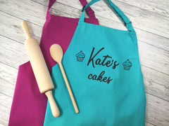 Personalised adult Welsh Cacennau apron in raspberry or duck egg blue with choice of coloured detail