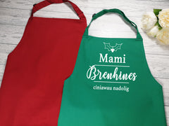 Personalised adult Welsh brenhines ciniawau nadolig apron in red or green