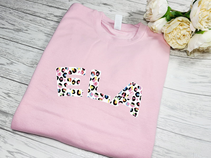 Personalised Unisex BABY PINK jumper Name in colourful leopard print detail