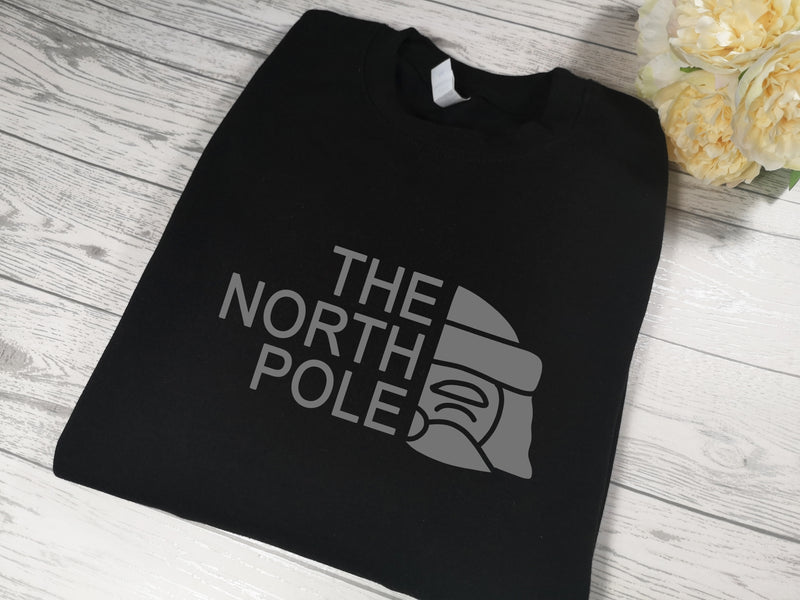 Custom Unisex BLACK The North Pole Christmas jumper  in a choice of detail colour