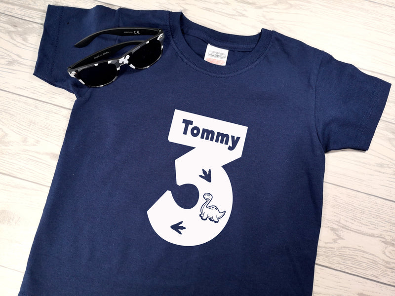 Personalised Kids Birthday Age Navy custom t-shirt with Dinosaur detail