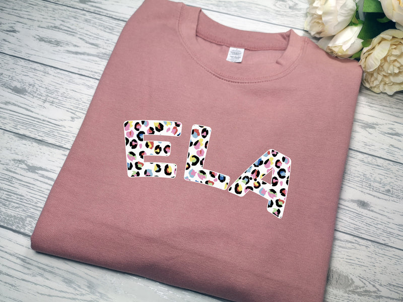 Personalised Unisex DUSKY PINK jumper Name in colourful leopard print detail