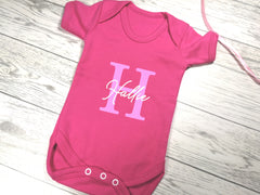 Personalised fuchsia pink Baby vest suit with letter and name detail