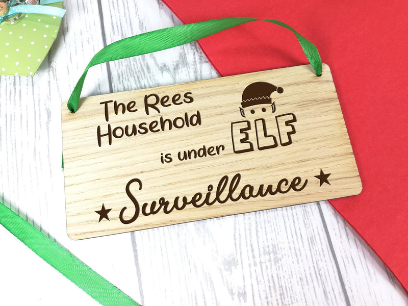 Personalised Engraved oak veneer 20cm hanging Christmas sign Elf surveillance Any Surname