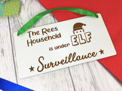 Personalised Engraved white 20cm hanging Christmas sign Elf surveillance Any Surname