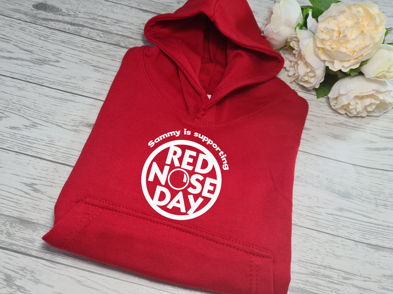 Personalised Red nose day kids RED hoodie with Name is supporting detail